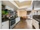 Open-concept kitchen with stainless steel appliances and a view into the dining area at 1491 Sunrise View Dr, Las Vegas, NV 89110