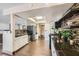 Well-lit kitchen with stainless steel appliances, a skylight, and wood-look floors at 1491 Sunrise View Dr, Las Vegas, NV 89110
