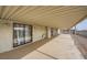 Long covered patio with concrete floor and tan supports at 1491 Sunrise View Dr, Las Vegas, NV 89110