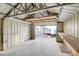 Interior view of the backyard shed showing the rafters, walls and concrete floor at 1491 Sunrise View Dr, Las Vegas, NV 89110