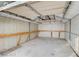 Interior view of the backyard shed, showcasing the walls, concrete floor and built in shelving at 1491 Sunrise View Dr, Las Vegas, NV 89110