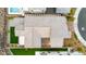 An aerial view of a home showing its roof, hardscape, turf and backyard layout, nestled in a well-designed neighborhood at 2004 Peaceful Mesa Ct, Henderson, NV 89052