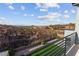 Balcony with iron railing overlooking scenic landscape with scattered homes and mountain views at 2004 Peaceful Mesa Ct, Henderson, NV 89052