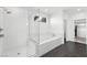 Modern bathroom featuring a glass enclosed shower and separate soaking tub at 2004 Peaceful Mesa Ct, Henderson, NV 89052