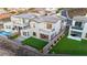 Stunning home features a pristine pool, lush turf, and a charming balcony overlooking a beautifully landscaped backyard at 2004 Peaceful Mesa Ct, Henderson, NV 89052