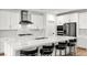 Bright, modern kitchen with white cabinets, stainless steel appliances and a large island with seating at 2004 Peaceful Mesa Ct, Henderson, NV 89052