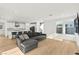 Inviting living room with hardwood floors, comfortable seating, and an open layout to the kitchen at 2004 Peaceful Mesa Ct, Henderson, NV 89052