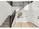 Home interior featuring a modern staircase with sleek railings and a stylish decor at 2004 Peaceful Mesa Ct, Henderson, NV 89052
