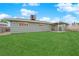 A home with a backyard with well-maintained lawn and shaded patio area at 2058 Citroen St, Las Vegas, NV 89142