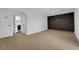 Spacious basement featuring carpet flooring, dark accent wall, and bright white walls at 2058 Citroen St, Las Vegas, NV 89142