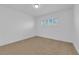 Bright and airy bedroom with neutral carpet, white walls, and ample natural light at 2058 Citroen St, Las Vegas, NV 89142