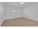 Bright bedroom with window shutter offers neutral carpet, white walls, and ample natural light at 2058 Citroen St, Las Vegas, NV 89142