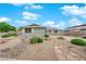 Charming single-story home with light green siding, rock landscaping and a welcoming stone walkway leading to the front door at 2058 Citroen St, Las Vegas, NV 89142