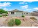 Charming single-story home with light green siding, rock landscaping and a welcoming stone walkway leading to the front door at 2058 Citroen St, Las Vegas, NV 89142