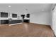 Open concept living space with wood-look flooring, recessed lighting, and sleek, modern kitchen at 2058 Citroen St, Las Vegas, NV 89142