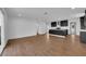Inviting living space featuring wood-look flooring, recessed lighting, and a stylish modern kitchen at 2058 Citroen St, Las Vegas, NV 89142