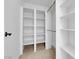 Spacious walk-in closet with multiple shelves and rod for ample storage at 2058 Citroen St, Las Vegas, NV 89142