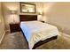 A bedroom featuring a large bed with a white comforter, two side tables, and a large mirror at 210 E Flamingo Rd # 215, Las Vegas, NV 89169