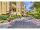 Beautiful exterior view of building with landscaped walkway and potted plants at 210 E Flamingo Rd # 215, Las Vegas, NV 89169