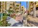 Beautiful condo building exterior with well-maintained landscaping and inviting entryway stairs at 210 E Flamingo Rd # 215, Las Vegas, NV 89169