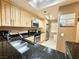 Modern kitchen with stainless steel appliances, granite countertops, and ample cabinet space at 210 E Flamingo Rd # 215, Las Vegas, NV 89169