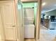 Convenient laundry closet featuring a stacked washer and dryer unit, maximizing space and functionality at 210 E Flamingo Rd # 215, Las Vegas, NV 89169