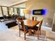 Charming living area boasting a dining table, plush seating, and a sleek fireplace for cozy evenings at 210 E Flamingo Rd # 215, Las Vegas, NV 89169