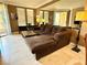 Comfortable living room featuring a large sectional couch, stylish decor, and access to an outdoor balcony at 210 E Flamingo Rd # 215, Las Vegas, NV 89169