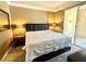 Serene main bedroom with sliding glass doors to a balcony, a plush bed, and ample natural light at 210 E Flamingo Rd # 215, Las Vegas, NV 89169
