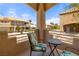 Charming balcony features comfortable seating and picturesque views of the surrounding neighborhood at 2200 Highpointe Dr # 202, Laughlin, NV 89029