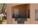 Balcony space with chairs offers a quiet spot to enjoy outdoor living with desert landscaping at 2200 Highpointe Dr # 202, Laughlin, NV 89029