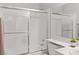 Bright bathroom featuring a shower-tub combination enclosed with a sliding glass door at 2200 Highpointe Dr # 202, Laughlin, NV 89029