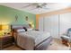 Comfortable bedroom features a ceiling fan, a rustic wood bed frame, and stylish matching nightstands at 2200 Highpointe Dr # 202, Laughlin, NV 89029