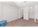 This bedroom has neutral walls, carpet floors, and open doors to closets and a bathroom at 2200 Highpointe Dr # 202, Laughlin, NV 89029
