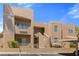 Contemporary building exterior with desert landscaping, covered parking, and visible unit numbers at 2200 Highpointe Dr # 202, Laughlin, NV 89029