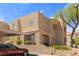 View of the building featuring covered parking, well-kept landscaping, and clear unit markers at 2200 Highpointe Dr # 202, Laughlin, NV 89029