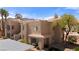 Charming condo featuring stucco exterior, tile roofing, and landscaped grounds at 2200 Highpointe Dr # 202, Laughlin, NV 89029