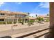 Exterior view of multi-unit building with desert landscaping and secure gated entry at 2200 Highpointe Dr # 202, Laughlin, NV 89029