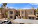 An exterior view of the building, featuring well-maintained landscaping and convenient covered parking at 2200 Highpointe Dr # 202, Laughlin, NV 89029
