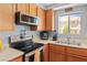 Modern kitchen features a stainless steel oven, microwave and updated countertops at 2200 Highpointe Dr # 202, Laughlin, NV 89029