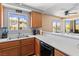 Kitchen with breakfast bar and view into a neighborhood featuring desert landscaping at 2200 Highpointe Dr # 202, Laughlin, NV 89029