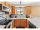 Bright kitchen features wood cabinets, stainless steel appliances, and modern fixtures at 2200 Highpointe Dr # 202, Laughlin, NV 89029