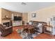 Inviting living room featuring a fireplace, wood floors, and comfortable furnishings at 2200 Highpointe Dr # 202, Laughlin, NV 89029