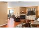 Comfortable living room with a fireplace, wood floors, and sliding glass doors to the outside at 2200 Highpointe Dr # 202, Laughlin, NV 89029