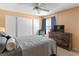 Comfortable bedroom with ceiling fan, dresser, and large window providing natural light at 2200 Highpointe Dr # 202, Laughlin, NV 89029