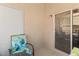 Cozy patio featuring a chair with colorful cushions, and a sliding glass door at 2200 Highpointe Dr # 202, Laughlin, NV 89029