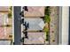 Aerial view of a residential area, showcasing homes with gray roofs and landscaped yards at 2433 Cingoli St, Henderson, NV 89044
