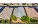 An aerial view of a single-story home featuring a landscaped backyard and well-maintained gray roof at 2433 Cingoli St, Henderson, NV 89044