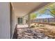 Covered backyard patio with brick flooring, trees, and a view at 2433 Cingoli St, Henderson, NV 89044