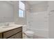 Bathroom with tub and shower combo, sink, and window at 2433 Cingoli St, Henderson, NV 89044